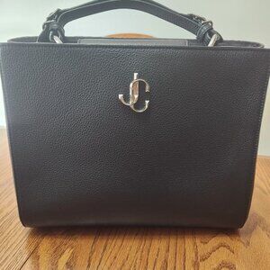 Only used for a few months. Wanted a smaller purse